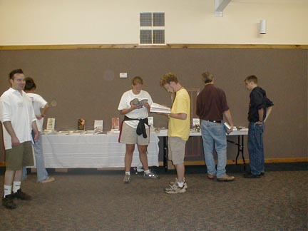 Students and Ozark staff browse book table