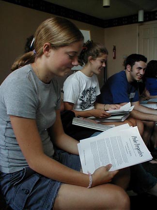 Katie Lepine looks at her stack of readings